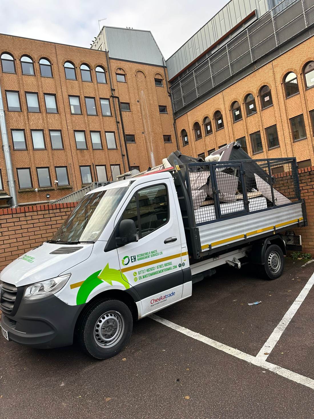 EH Waste Management truck fully loaded with furniture and household waste
