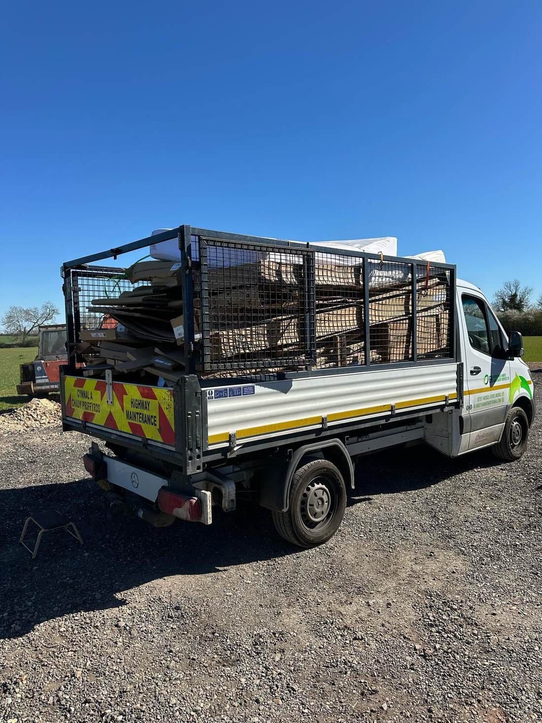 EH Waste Management truck loaded with pallets, cardboard and construction waste